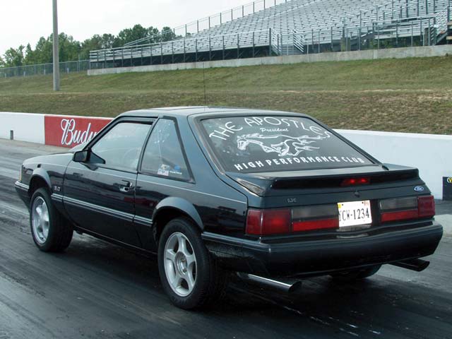 0211mmff_04zoom Ford_Mustang Rear_Drivers_Side_View_At_Track