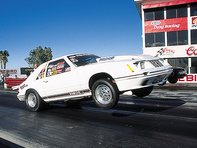 0405mm_14z 1984_Ford_Mustang_GT Passenger_Side_View_At_Track