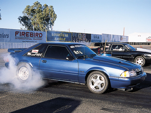 0405mm_36z 1987_Ford_Mustang Passenger_Side_View_At_Track