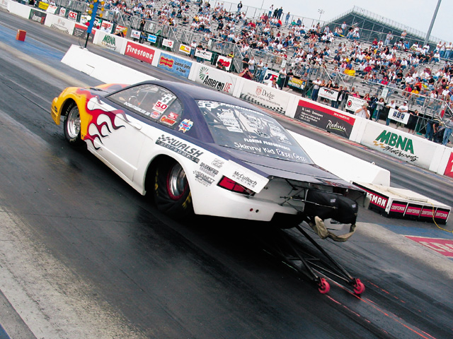 0310mm_02z Ford_Mustang Rear_Drivers_Side_View_At_Track