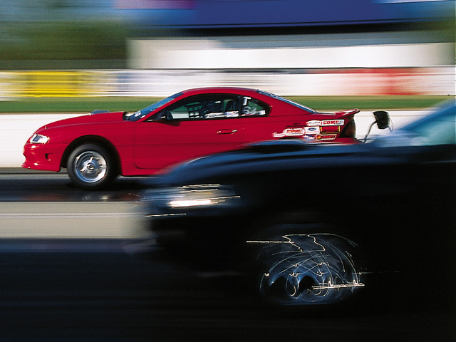 0308mm_04z Ford_Mustang Drivers_Side_View_At_Track