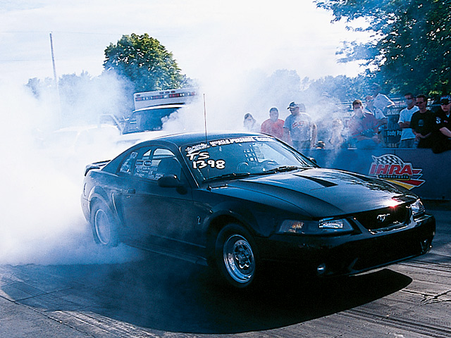 0412mm_03z Ford_Mustang Front_Passenger_Side_View_At_Track
